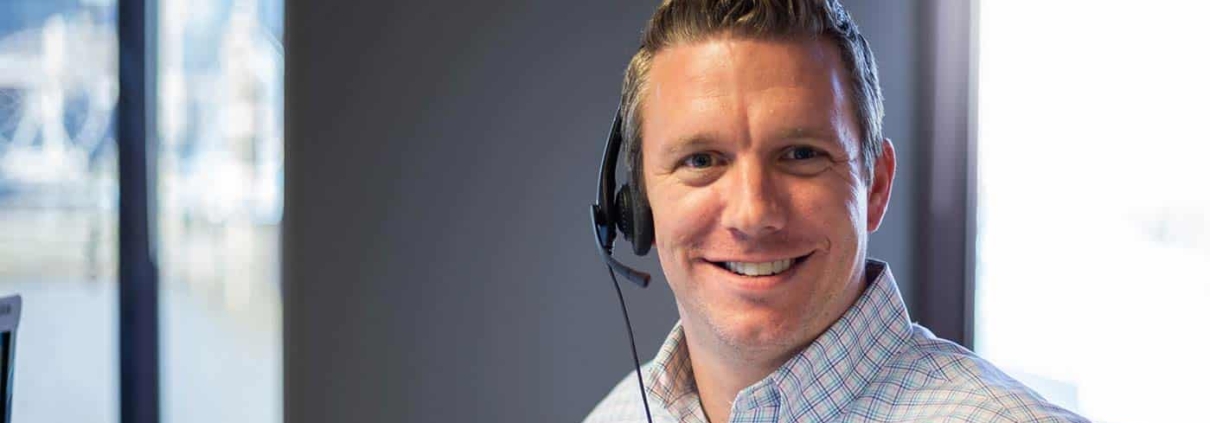 Man smiling with headset