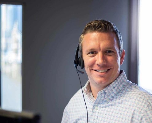 Man smiling with headset