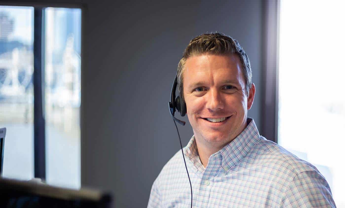 Man smiling with headset