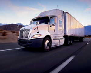 Shipping truck driving on a desert highway