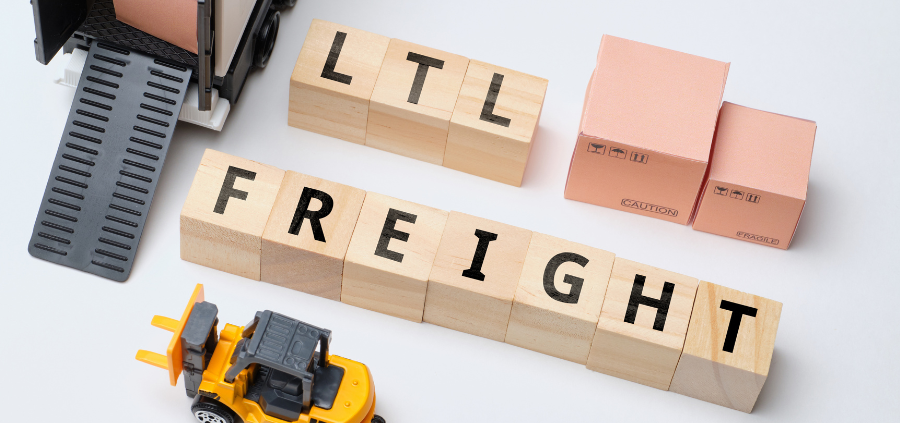 Small cubes with LTL FREIGHT written on them are sitting against a white background